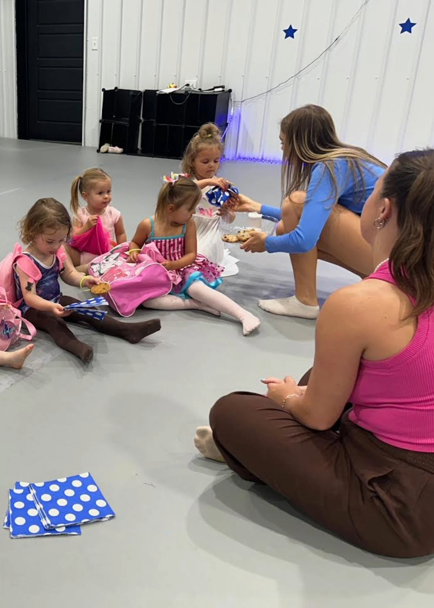 students having cookies in dance class